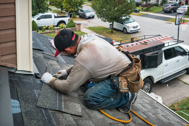 Professional Roofing technician working in Durango, IA